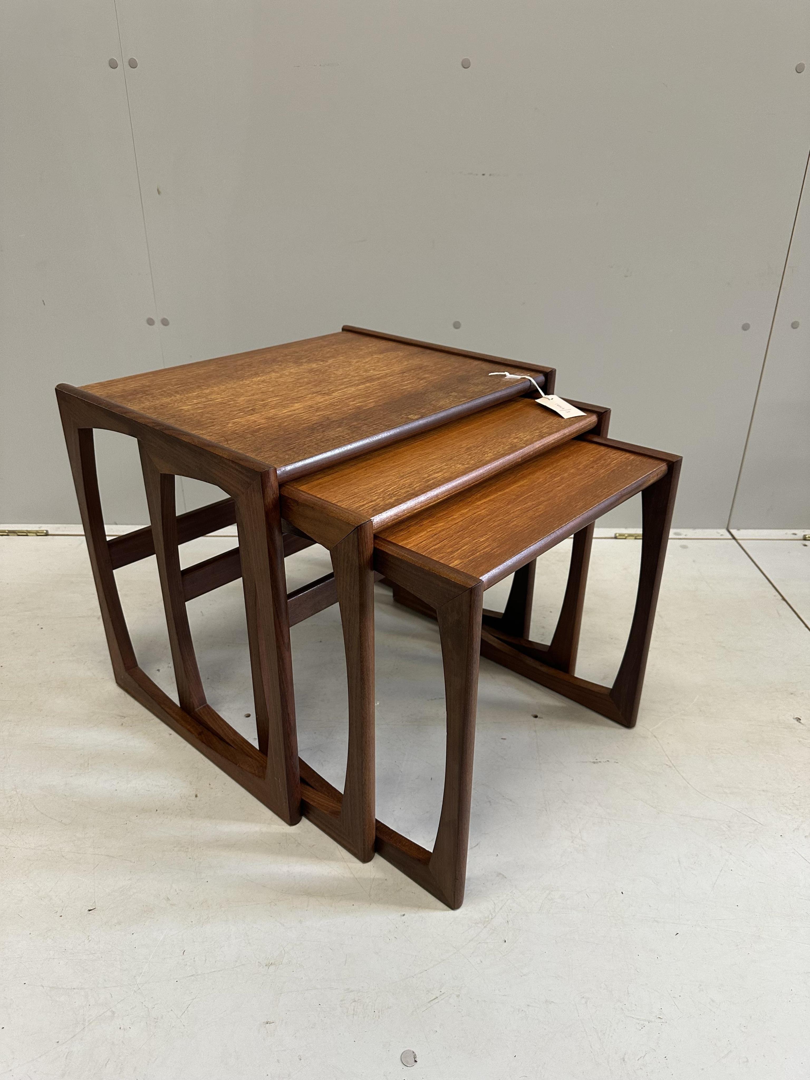 A nest of three mid century G Plan teak tea tables, width 53cm, depth 43cm, height 49cm. Condition - fair